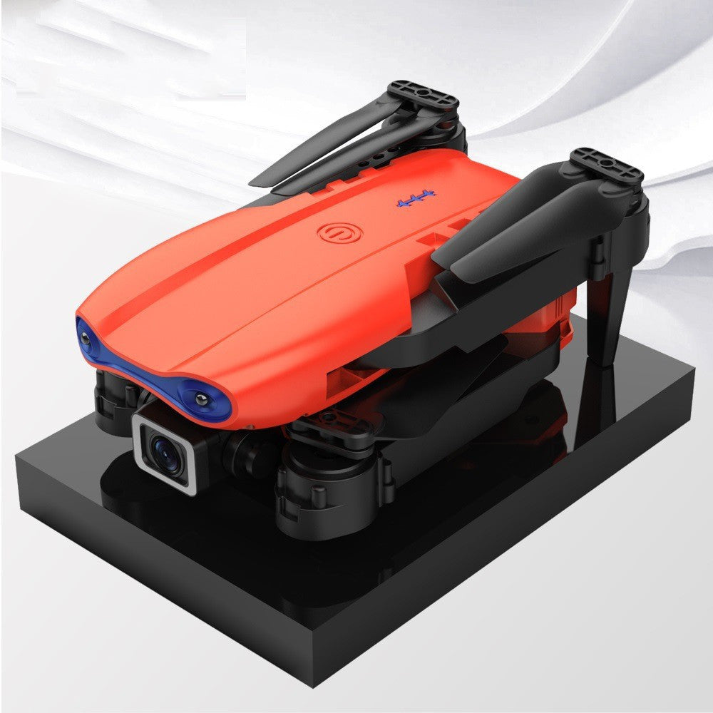 Black foldable drone flying outdoors