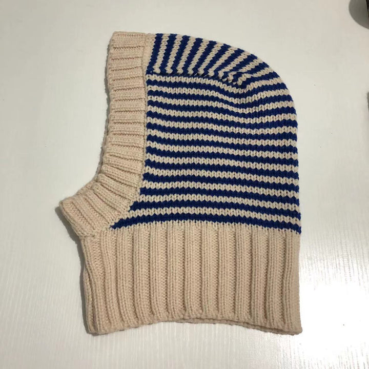 Person wearing striped knitted balaclava hood