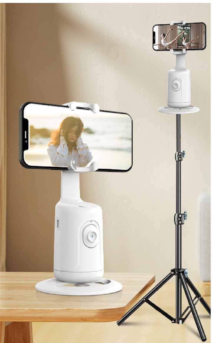 Face-tracking phone holder rotating with phone