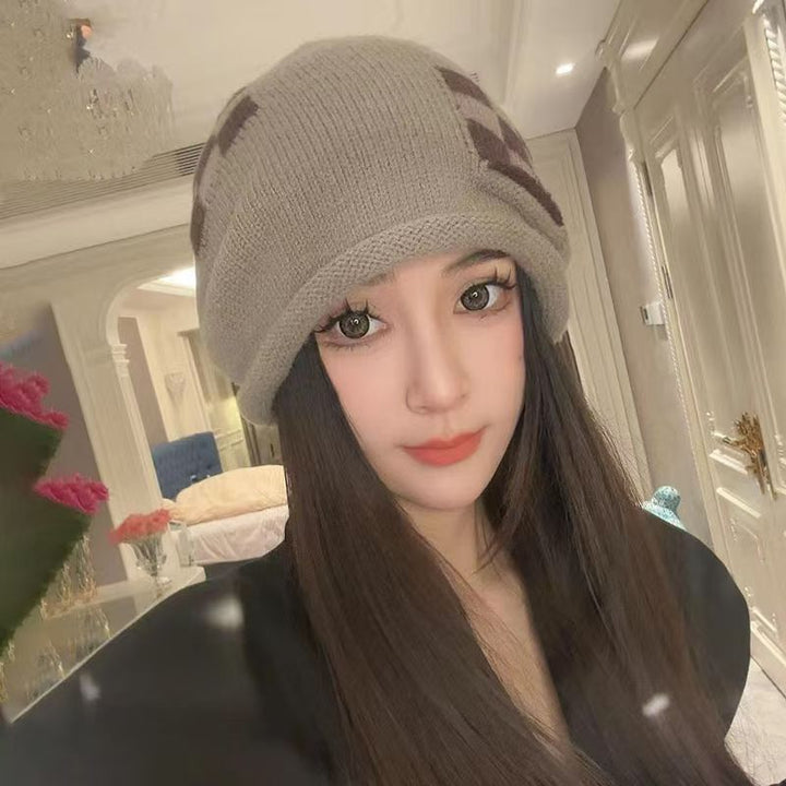 Off-white knitted beret with folded brim