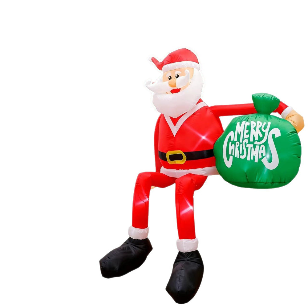Giant inflatable Santa with gift sack in garden