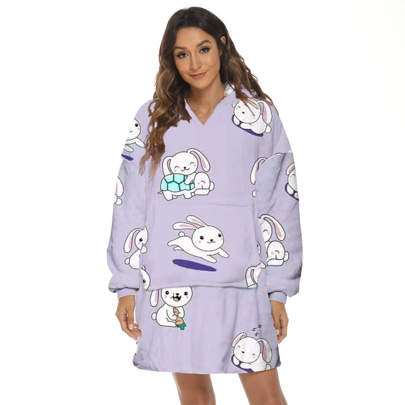 Person wearing oversized panda hooded blanket