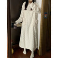 Woman in long pink coral fleece nightgown