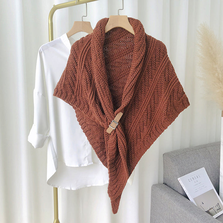 Woman in chunky knit triangle scarf with buckle