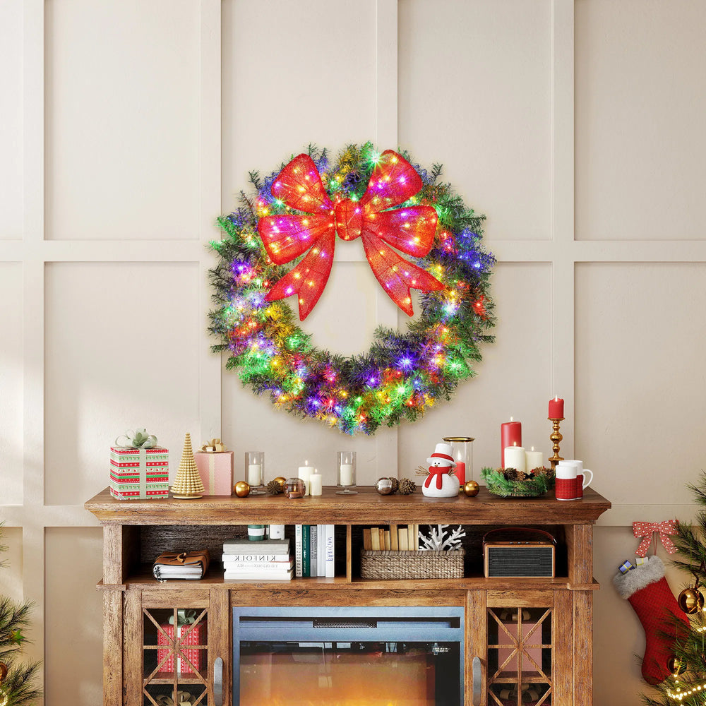 Large lit Christmas wreath with red bow