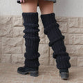 Chunky slouchy knitted leg warmers over boots