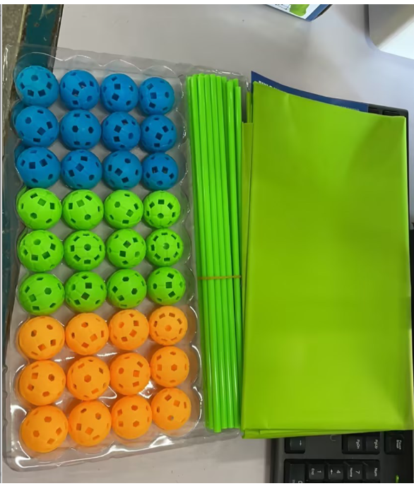 Children building glowing den from sticks