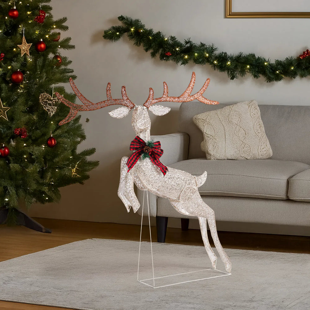 Light-up jumping reindeer with red bow